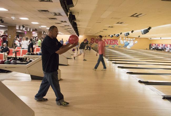 Man bowling at event