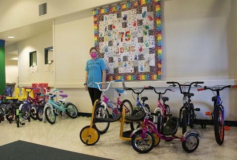 Girl Scout with donated bikes