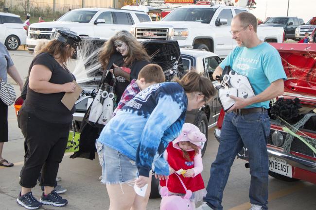 Volunteers pass out candy