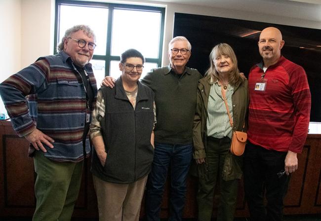 Hille pictured with current and retired employees